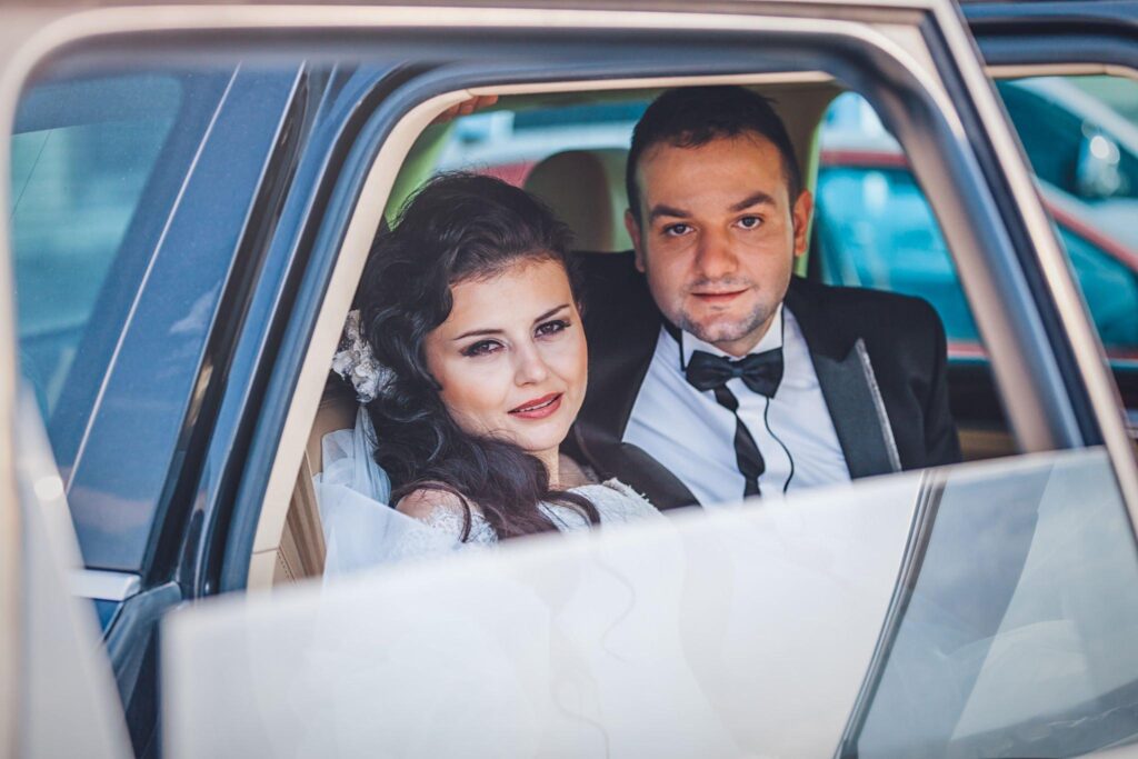 Bride and groom inside a luxury shuttle